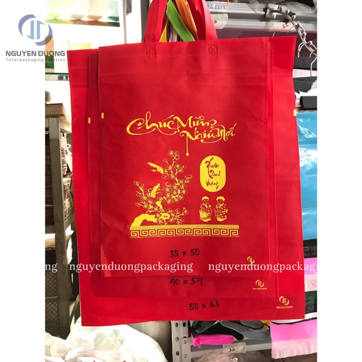 Túi vải không dệt đựng Lịch in Chúc Mừng Năm Mới dạng Phẳng đột lỗ/quai rời